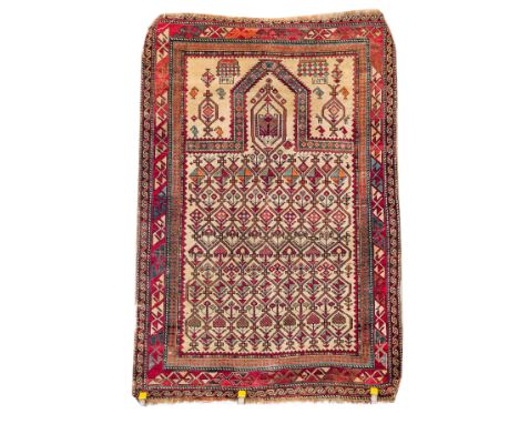 A DAGHESTAN PRAYER RUG, CAUCASIANThe ivory mirror filled with a trellis of single flowering plants rising to a single stylise