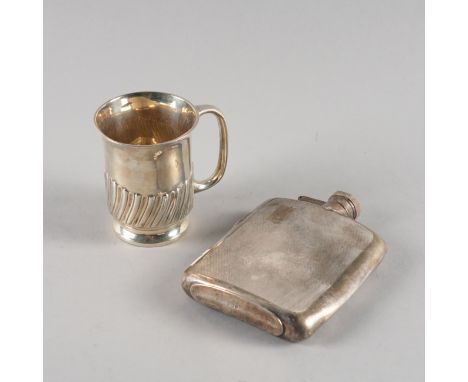 A SILVER CHRISTENING MUG AND A SILVER SPIRIT FLASK (2)The mug with semi spiral fluted decoration, height 8cm, Sheffield 1904,