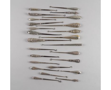 A COLLECTION OF SILVER HANDLED BUTTON HOOKS (25)Mostly Birmingham examples, the longest measuring 27.3cm, the smallest measur