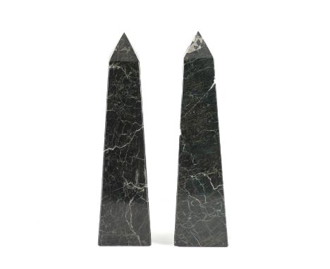 A PAIR OF BLACK VARIEGATED MARBLE ORNAMENTAL OBELISKS (2)20th Century 
One with a stylised architectural motif, 41cm high