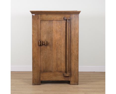 A CONTINENTAL STAINED OAK SINGLE DOOR CUPBOARDWith unusual hinge, 109cm wide; 55cm deep; 162cm highMeasurements provided are 
