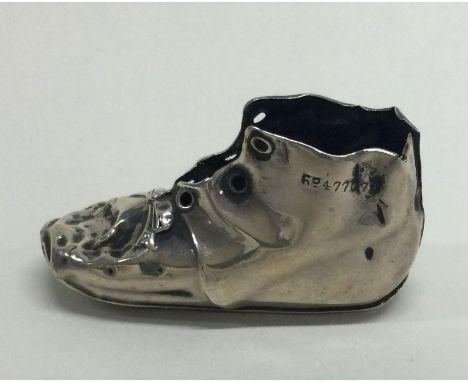 A silver model of a boot. Birmingham 1906. Approx. 5 grams. Est. £20 - £30.