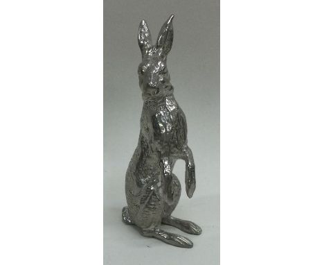 A novelty silver standing model of a hare. Import marked. Approx. 220 grams. Est. £300 - £500.