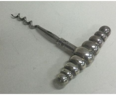 A novelty Victorian silver corkscrew. Birmingham 1890. Approx. 8 grams. Est. £60 - £80.