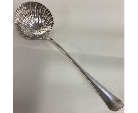 A large George III bottom marked fluted silver soup ladle. London 1764. By Thomas & William Chawner. Approx. 160 grams. Est. 