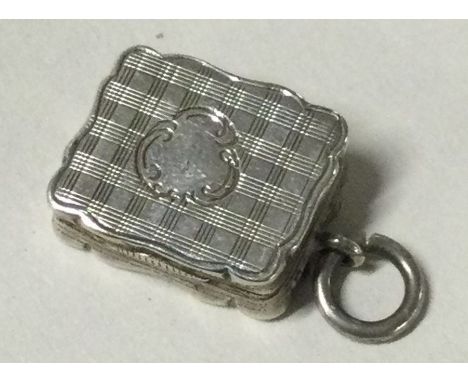 A silver Victorian engine turned vinaigrette. Birmingham 1856. By Alfred Taylor. Approx. 4 grams. Est. £80 - £120.