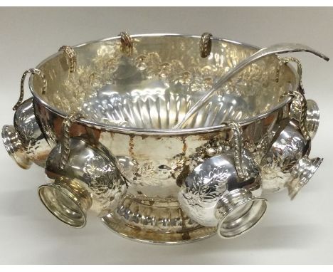 A good silver plated punch bowl together with matching ladle and cups. Est. £20 - £30.