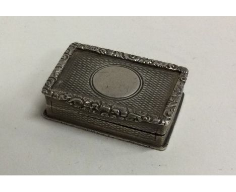 A heavy engine turned Victorian silver vinaigrette. Birmingham 1898. By George Unite & Sons. Approx. 35 grams. Est. £150 - £2