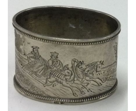 An early 20th Century Russian silver napkin ring engraved with equestrian scenes. Approx. 36 grams. Est. £80 - £120.