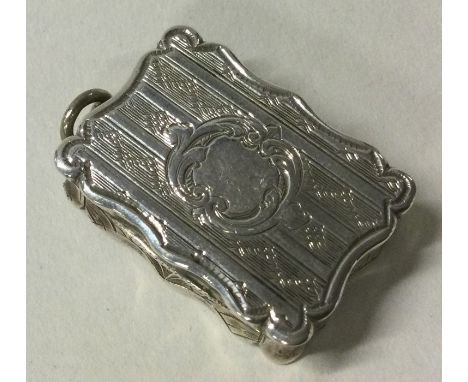 A Victorian engine turned silver vinaigrette  Birmingham 1860 by Edward Smith. Approx. 14 grams. Est. £80 - £120.