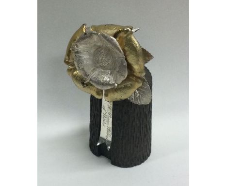 CHRISTOPHER LAWRENCE: A silver model of a flower. Approx. 455 grams. Est. £150 - £200.