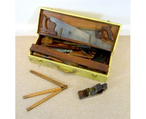 A set of vintage tools and carry toolbox painted yellow, including woodworking tools, a large pair of wooden compasses, a mic