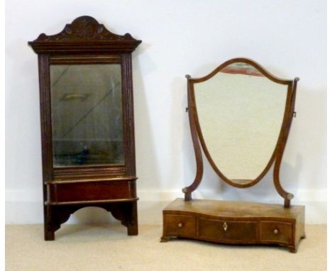 A 19th century mahogany toilet mirror with lyre shaped supports and shield shaped plate, set with turned ivory decoration, be