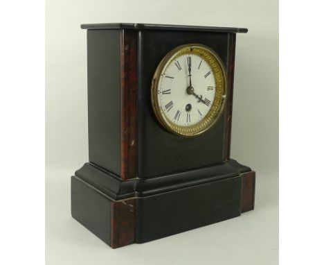 A Victorian slate and marble mantel clock, white face with Roman numerals, with pendulum, lacking key, 23 by 12 by 25cm. 