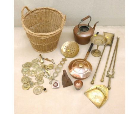 A collection of copper and brass items, including a copper kettle with acorn finial, a milk skimmer, a bed warmer, a cast Jap
