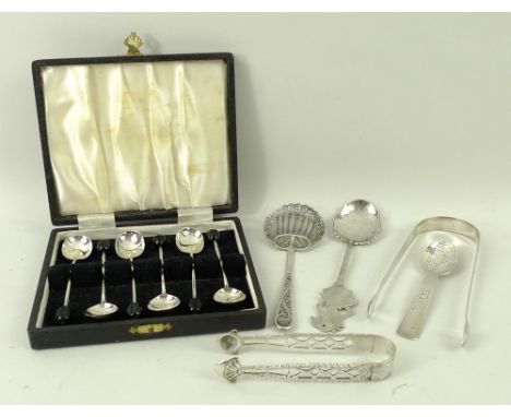 A collection of assorted silver items to include a Balinese 'Dancing Puppet' spoon, a white metal filigree spoon, a Mexican s