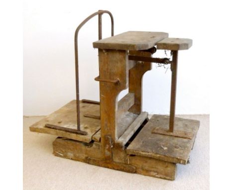 A set of vintage sack scales, the wooden base with metal working parts, 95 by 50 by 84cm high, together with four weights. (5
