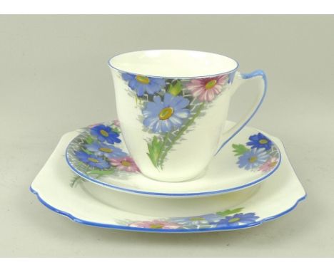 A Shelley part tea service, pattern number 12216, decorated with blue and pink flowers, comprising six cups, saucers, and squ