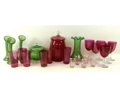 A group of six cranberry wine glasses, a cranberry jar with a cut glass finial, 21cm, six cranberry glass tumblers, five pink