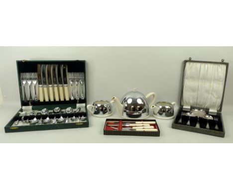 An 'Everhot' retro teaset, with stainless steel covers, comprising tea pot, milk jug and sugar bowl, a six place setting cant