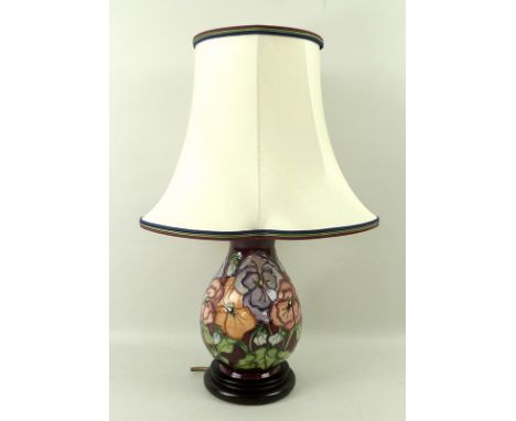 A Moorcroft baluster table lamp, in the 'Pansy' pattern, with original shade and label, 46cm. 