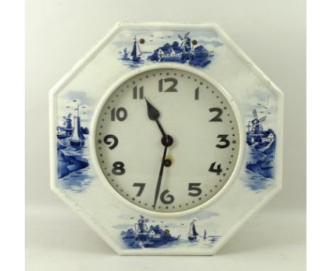 A vintage Delftware wall clock, the ceramic front surround decorated in blue and white with Dutch windmill and river scenes, 