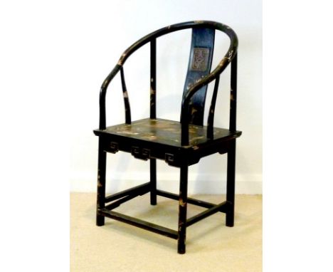 An early to mid 20th century Chinese hardwood and black lacquered open armchair, with curved arms and single rectangular spla