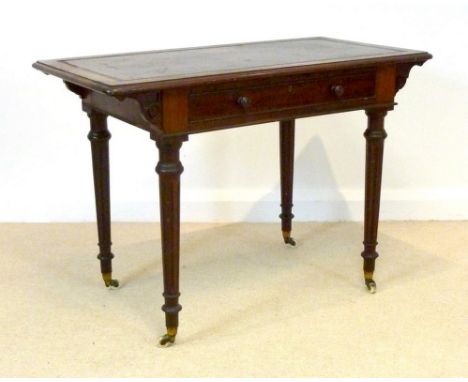 An early Victorian walnut writing desk, with green tooled leather top, single frieze drawer with cock beading and turned hand