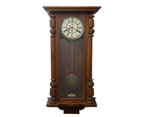 A Vienna wall clock, walnut case with three glass sides, white ceramic face with subsidiary dial and Roman numerals, 42 by 17