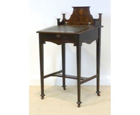 An Art Nouveau mahogany lady's desk, with lift lid, with tooled leather and fitted inkwells, the back with marquetry inlaid s