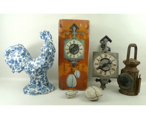 A reproduction stone driven clock, a ceramic cockerel under glazed with blue print flowers, 40cm, and a railway lamp, impress