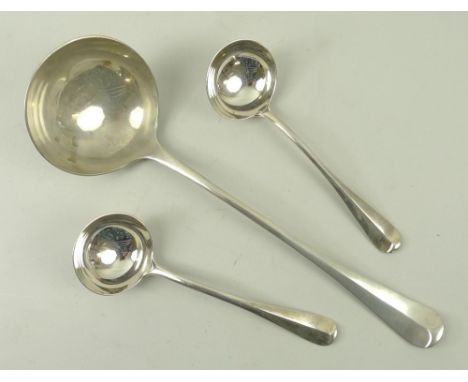 A silver ladle with rat tail to bowl, monogram to underside of handle EPMC, London 1908, William Hutton and Sons, 32cm, and t