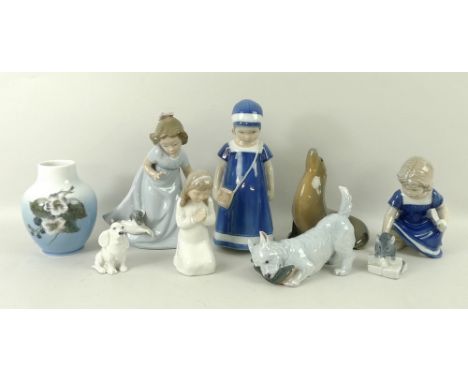 A group of seven Royal Copenhagen figurines, comprising girl, number 707, a girl crouching, number 672, a seal, number 1441, 