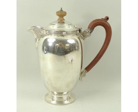 A silver coffee pot, with Celtic strapwork to the collar and spout, with boxwood handle and finial, the handle terminating in