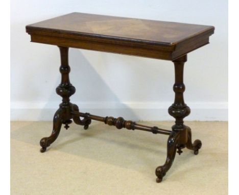 An early Victorian walnut fold over card table, the rectangular top of burr walnut, inlaid with a quarter cut walnut square t