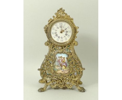 A French travelling clock, 20th century, with ornate scrollwork, the face with Roman numerals and Arabic minute numerals, wit