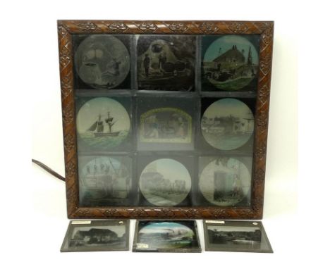 A group of nine Victorian slides set within a light box, 28 by 12 by 28cm, and three further loose slides, hand coloured, 8 b
