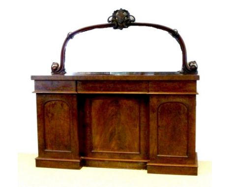 A Victorian flame mahogany chiffonier, the mirror back framed and surmounted by a carved foliate cartouche, the three frieze 