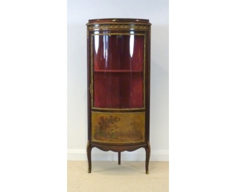 A Louis XVI style, mid 20th century, cylinder front corner display cabinet, with gilded metal mounts, and printed panel below