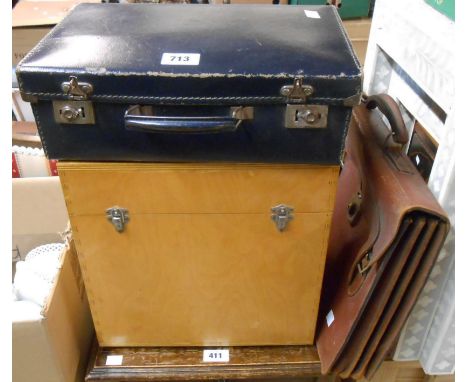 A small fibreboard suitcase containing a quantity of collectable items including cutlery, etc. and a satchel style briefcase 