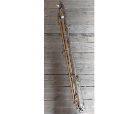 A vintage split cane 'The Favourate' three section spinning rod with two tips and rod plugs - sold with three section split c