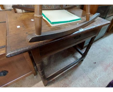 A 94cm 18th Century oak side table with relined frieze drawer, set on an open stretcher base with bobbin turned supports