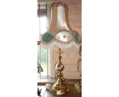 A modern cast brass table lamp of candlestick form - sold with a shade