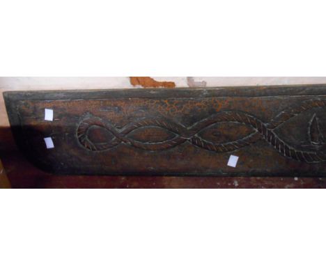An early 20th Century folk art carved wood maritime panel featuring man-o-war, two other craft and sailor's knots within rope