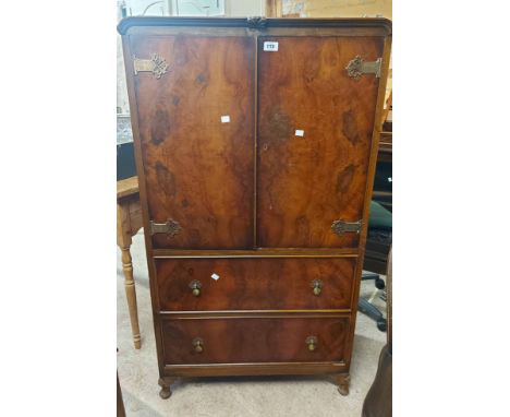 A 77cm vintage walnut tallboy with shelf enclosed by a pair of doors with Oriental style hinges over two deep long drawers, s