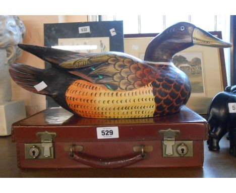 A modern painted carved wood decoy style duck model - sold with a small vintage suitcase
