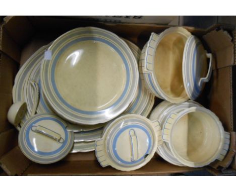 A box containing an Art Deco Bovey Pottery part dinner service including sauce tureens, ladles, plates, etc.