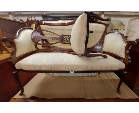 An Edwardian decorative inlaid mahogany show frame parlour suite with cream coloured machine tapestry upholstery comprising a