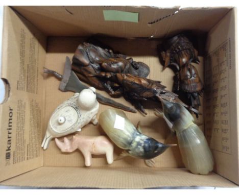 A box containing a quantity of collectable items including two carved figures in Balinese style, a small Eastern dagger with 