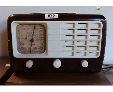 An Art Deco Bakelite cased 'Ultra' T401 radio, with white contrasting grill and knobs
